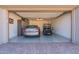 Spacious garage with organized storage and room for vehicles, offering a clean and functional space at 247 E Las Puertas Ln, Queen Creek, AZ 85140