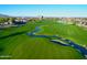 Beautiful golf course with a winding stream, sand trap, and lush green grass at 247 E Las Puertas Ln, Queen Creek, AZ 85140