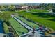 Lawn bowling area with clubhouse, tables and lounge area at 247 E Las Puertas Ln, Queen Creek, AZ 85140