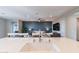 Open concept kitchen/living room area with stylish decor and ample natural light at 247 E Las Puertas Ln, Queen Creek, AZ 85140