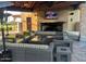 Comfortable outdoor patio includes a fireplace and television, providing relaxing space for community residents at 247 E Las Puertas Ln, Queen Creek, AZ 85140
