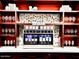 Custom wine display showcasing a selection of wines with elegant glassware and lighting for a sophisticated look at 247 E Las Puertas Ln, Queen Creek, AZ 85140