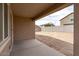 Covered patio overlooking the expansive backyard with block wall at 24868 W Kowalsky Ln, Buckeye, AZ 85326