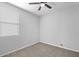 Bedroom with neutral walls, carpeted floors, and bright window at 24868 W Kowalsky Ln, Buckeye, AZ 85326