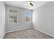 Bedroom with carpeted floors and windows at 24868 W Kowalsky Ln, Buckeye, AZ 85326