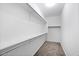 Walk-in closet with built-in shelves and rods for storage at 24868 W Kowalsky Ln, Buckeye, AZ 85326