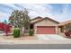 Charming single-story home featuring a two-car garage and desert landscaping at 24868 W Kowalsky Ln, Buckeye, AZ 85326