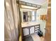 Well-lit bathroom with a large mirror, a vanity with storage, and a shower-tub combination at 25 S 102Nd St # 47, Mesa, AZ 85208