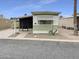 Charming home with a desert-friendly yard and a white and green exterior color scheme at 25 S 102Nd St # 47, Mesa, AZ 85208