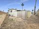Backyard with storage shed and palm trees at 25 S 102Nd St # 47, Mesa, AZ 85208