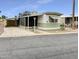 Cozy home with a covered carport, desert landscaping, and a charming curb appeal at 25 S 102Nd St # 47, Mesa, AZ 85208