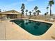 Sparkling community pool surrounded by lounge chairs and lush landscaping at 25 S 102Nd St # 47, Mesa, AZ 85208