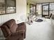 Enclosed porch with comfortable seating, offering a relaxing and versatile outdoor living space at 25 S 102Nd St # 47, Mesa, AZ 85208