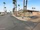 Charming neighborhood with well-maintained landscaping and beautiful palm trees lining the streets at 25 S 102Nd St # 47, Mesa, AZ 85208