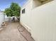 Backyard featuring a mature tree, gravel, and exterior storage at 25 S 102Nd St # 73, Mesa, AZ 85208