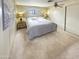 A cozy bedroom featuring a queen-sized bed, neutral carpet and a ceiling fan at 25 S 102Nd St # 73, Mesa, AZ 85208