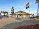 Clubhouse with desert landscaping and flags at 25 S 102Nd St # 73, Mesa, AZ 85208