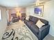 A comfortable living room featuring a plush sofa, recliner chairs and patterned rug at 25 S 102Nd St # 73, Mesa, AZ 85208