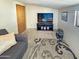 A comfortable living room featuring a plush sofa, and patterned rug at 25 S 102Nd St # 73, Mesa, AZ 85208