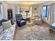 Comfortable living room featuring a plush sofa, recliner seating, patterned rug, and ample natural light at 25 S 102Nd St # 73, Mesa, AZ 85208