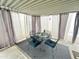 Charming outdoor patio with a table, four chairs and privacy curtains at 25 S 102Nd St # 73, Mesa, AZ 85208