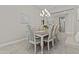 Elegant dining room with a chandelier, stylish furniture, and neutral color palette at 30406 N 116Th Ln, Peoria, AZ 85383