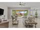 Open-concept living area flows to outdoor living with large glass sliding doors at 30406 N 116Th Ln, Peoria, AZ 85383