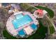 Aerial view of a community pool, playground and park with shade structures and lounge areas at 30406 N 116Th Ln, Peoria, AZ 85383