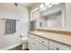 Bright bathroom featuring granite countertops, a shower with tiled walls, and neutral wall color at 3149 W Danbury Dr, Phoenix, AZ 85053
