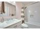 Modern bathroom featuring a white vanity, a marble countertop, and subway tiled shower/tub at 3149 W Danbury Dr, Phoenix, AZ 85053