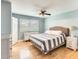 Comfortable bedroom with natural light, hardwood flooring, and minimalist decor, creates a serene atmosphere at 3149 W Danbury Dr, Phoenix, AZ 85053