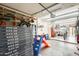 Spacious garage with ample storage, a work bench, and room for recreational equipment at 3149 W Danbury Dr, Phoenix, AZ 85053