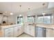 Modern kitchen featuring stainless steel appliances, sleek countertops, and ample natural light at 3149 W Danbury Dr, Phoenix, AZ 85053
