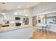 Bright, open kitchen with modern appliances, an island, and an adjacent dining area at 3149 W Danbury Dr, Phoenix, AZ 85053