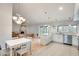 Open-concept kitchen with modern appliances, a dining area, and backyard views at 3149 W Danbury Dr, Phoenix, AZ 85053