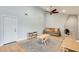 Bright living room featuring hardwood floors, a charming brick fireplace, and ample space for activities at 3149 W Danbury Dr, Phoenix, AZ 85053