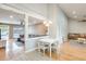 Open-concept living area with a dining table, seamlessly connected to the cozy living room at 3149 W Danbury Dr, Phoenix, AZ 85053
