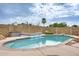 Backyard pool features a soothing waterfall feature, perfect for relaxation and enjoyment at 3149 W Danbury Dr, Phoenix, AZ 85053