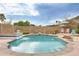 This backyard oasis features a refreshing pool with a playful yellow duck and lounge area at 3149 W Danbury Dr, Phoenix, AZ 85053
