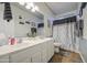 Well-lit bathroom featuring a double sink vanity and decorative accents enhancing the room's aesthetic appeal at 3270 W White Canyon Rd, San Tan Valley, AZ 85144