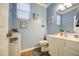 Charming powder room with beach-themed decor and a neutral vanity with ample storage at 3270 W White Canyon Rd, San Tan Valley, AZ 85144