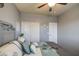 Comfortable bedroom with coordinated bedding, a neutral palette, and ample closet space for optimal storage solutions at 3270 W White Canyon Rd, San Tan Valley, AZ 85144