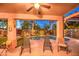 Outdoor patio with decorative touches overlooking the pool and backyard, perfect for relaxation at 3270 W White Canyon Rd, San Tan Valley, AZ 85144