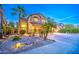 Charming two-story home featuring a well-manicured front yard, mature palm trees, and a spacious driveway at 3270 W White Canyon Rd, San Tan Valley, AZ 85144