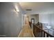 Well lit hallway with wood floors and views of the stairwell and railing at 3270 W White Canyon Rd, San Tan Valley, AZ 85144