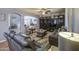 Cozy living space showcasing an entertainment center, neutral decor, and comfortable leather seating at 3270 W White Canyon Rd, San Tan Valley, AZ 85144