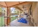 Enjoy the covered patio with a ceiling fan overlooking the pool and backyard at 3270 W White Canyon Rd, San Tan Valley, AZ 85144