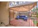 Cozy covered patio with comfortable seating and outdoor decor for relaxation and entertaining at 3270 W White Canyon Rd, San Tan Valley, AZ 85144