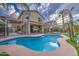 The pool has a gorgeous sparkling water and covered back patio at 3270 W White Canyon Rd, San Tan Valley, AZ 85144
