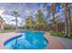 A beautiful sparkling pool with a custom deck and landscaping at 3270 W White Canyon Rd, San Tan Valley, AZ 85144
